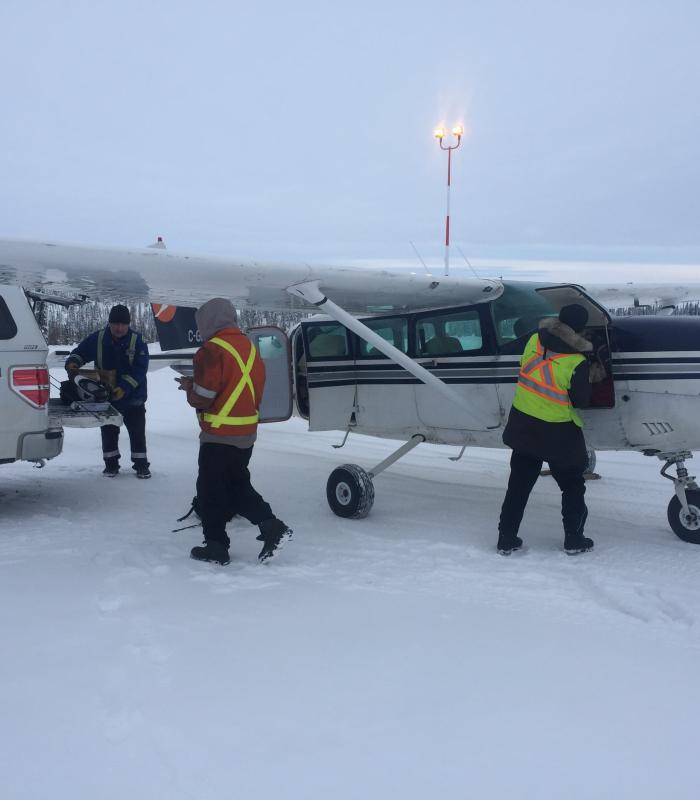 Loading up tools to fly into a remote northern community for diesel generator repair.